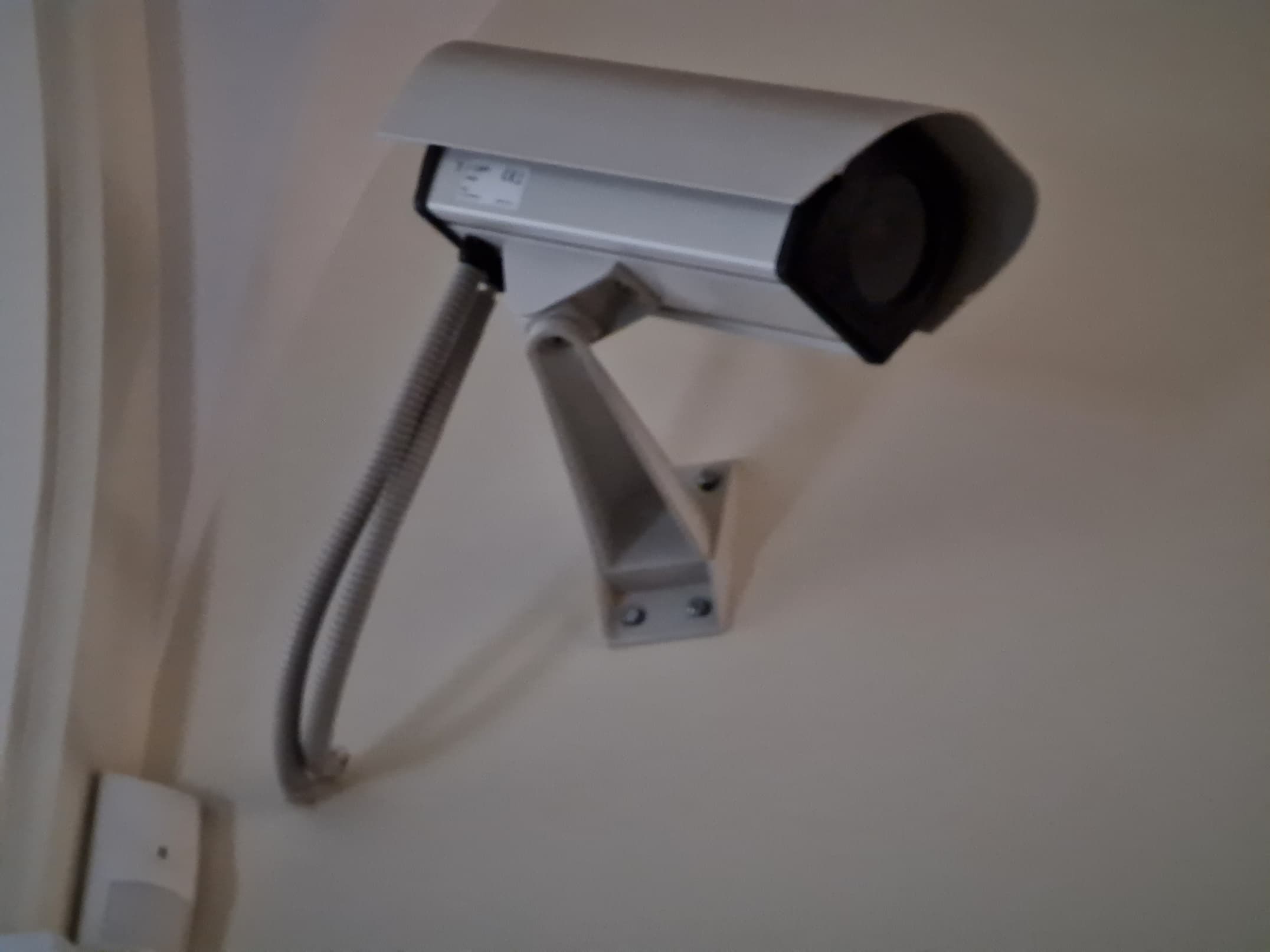 Outdoor CCTV camera mounted on a building in Poland.