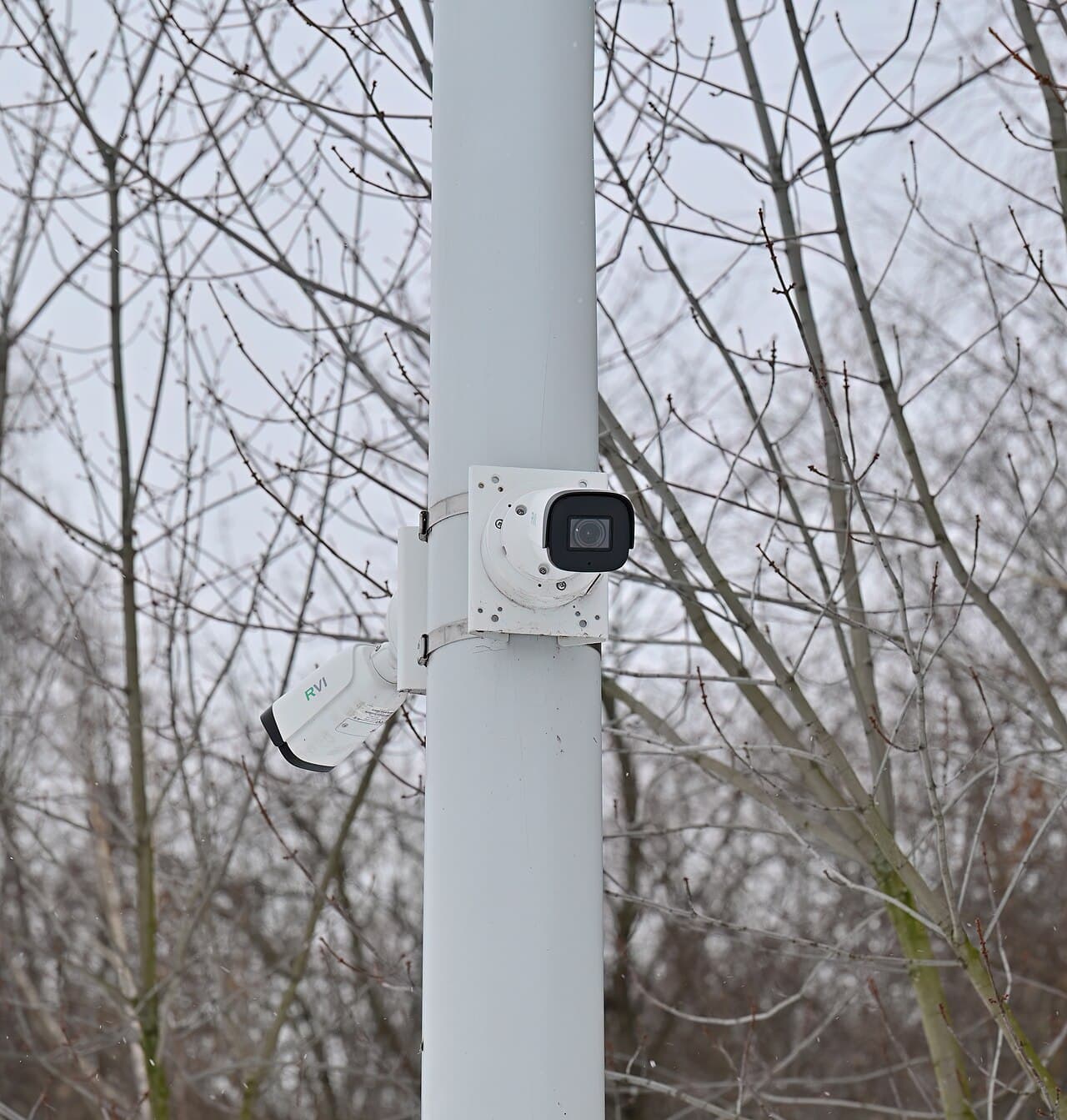 Outdoor surveillance camera mounted on a pole in a public area.